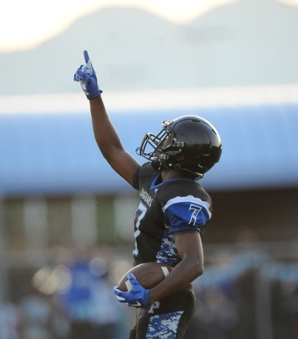 Desert Pines running back Isaiah Morris celebrates after scoring on a 42-yard run during the ...