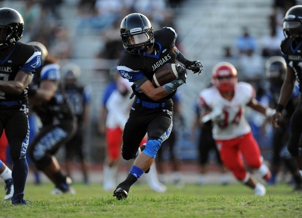 Desert Pines wide receiver Amari Tatum (3) runs the ball against Arbor View in the first qua ...