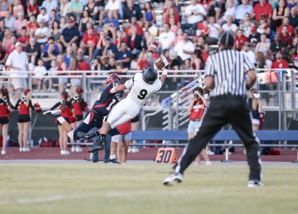 Palo Verde High School Junior Tyler Thornton (9) makes an interception while Coronado High S ...