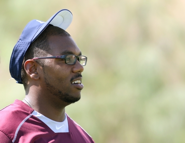 Agassi Prep head coach Isaac Watts watches his team warm up during practice at Doolittle Par ...