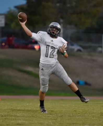 Green Valley quarterback A.J. Amelburu passes the ball against Las Vegas during a high schoo ...