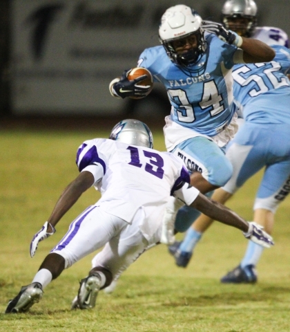 Foothill‘s Justice Jackson (34) jumps to evade Silverado‘s Vernon Jackson (13) d ...