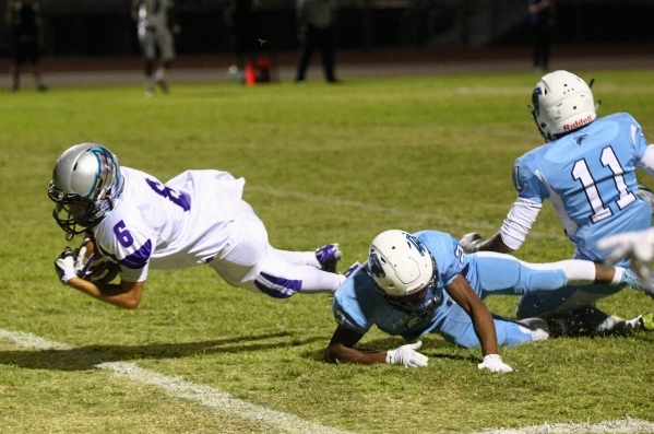 Silverado‘s Evan Tafoya (6) gets past Foothill defense to score a touchdown during a f ...