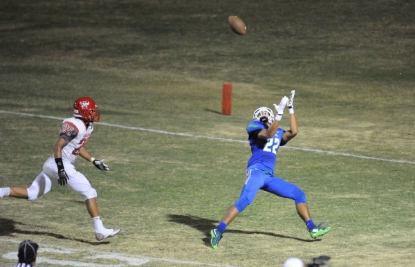 Green Valley wide receiver Christian Mayberry (22) catches a touchdown pass as Arbor View sa ...