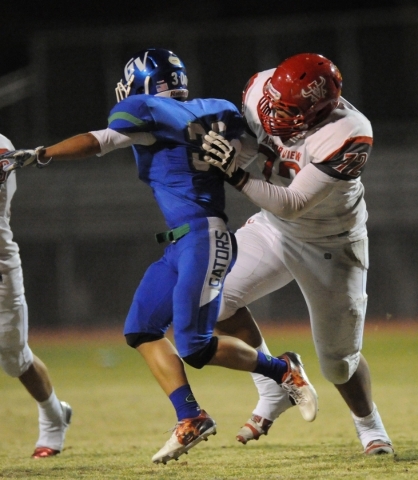 Arbor View linebacker Keenen King (72) blocks Green Valley cornerback Avery Fleharty in the ...