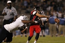 Centennial defensive lineman Greg Rogers tackles Las Vegas quarterback Trevor Swenson at Las ...