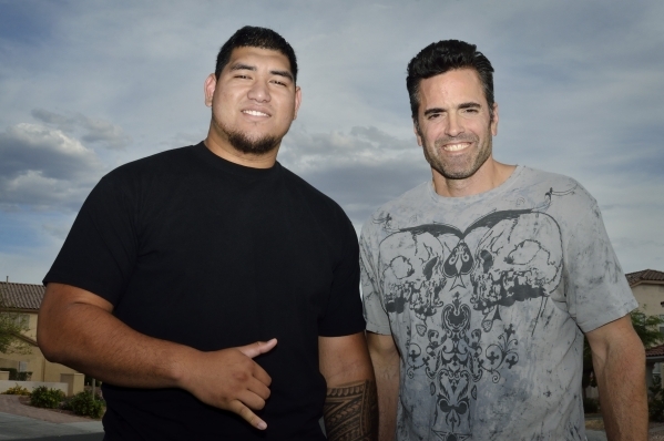 Jeremiah Poutasi, left, is shown with his high school guidance counsellor Sean Abid in front ...