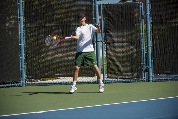 Mackay Boman of Green Valley High School hits a forehand against Kyle Harris of Coronado Hig ...