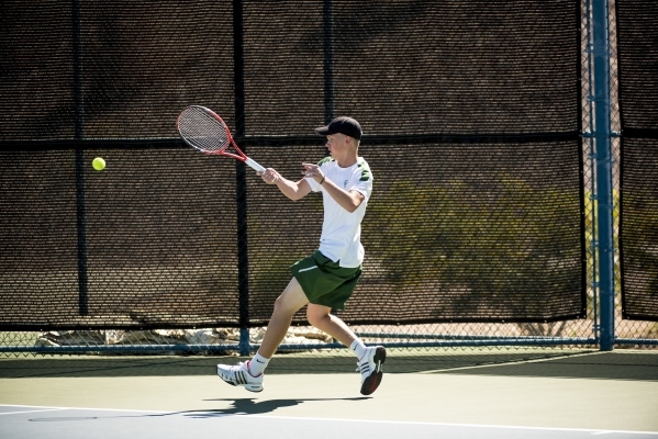 Mackay Boman of Green Valley High School hits a forehand against Kyle Harris of Coronado Hig ...