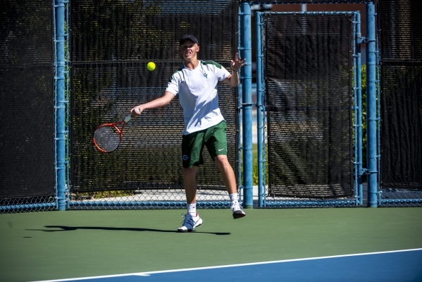 Mackay Boman of Green Valley High School hits a forehand against Kyle Harris of Coronado Hig ...