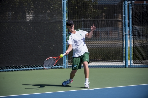 Mackay Boman of Green Valley High School hits a forehand against Kyle Harris of Coronado Hig ...