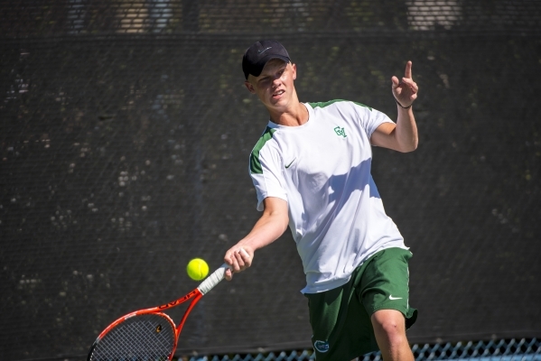 Mackay Boman of Green Valley High School hits a forehand against Kyle Harris of Coronado Hig ...