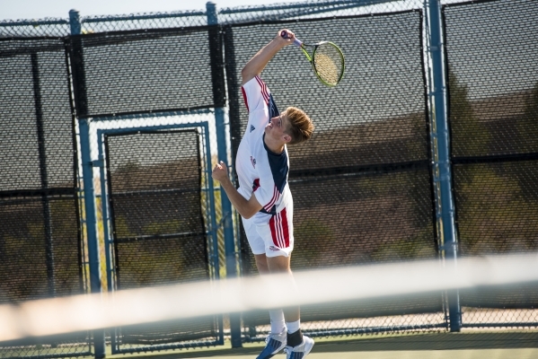 Ryland McDermott of Coronado High School serves against Petar Matejic of Green Valley High S ...