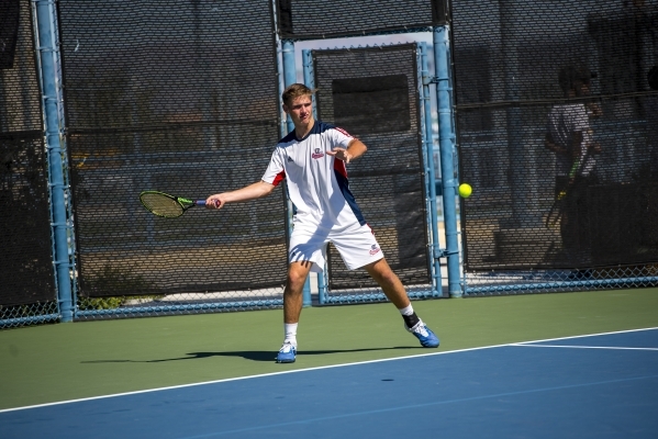 Ryland McDermott of Coronado High School hits a forehand against Petar Matejic of Green Vall ...