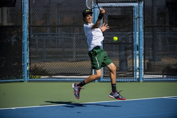 Petar Matejic of Green Valley High School hits a forehand against Ryland McDermott of Corona ...