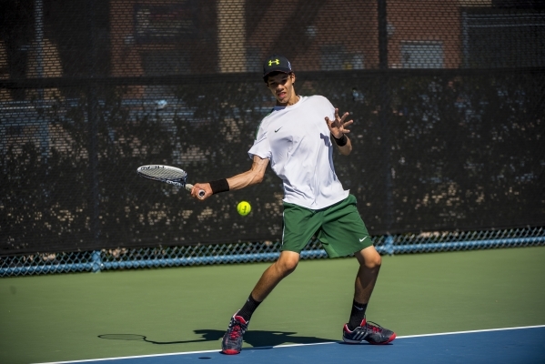 Petar Matejic of Green Valley High School hits a forehand against Ryland McDermott of Corona ...