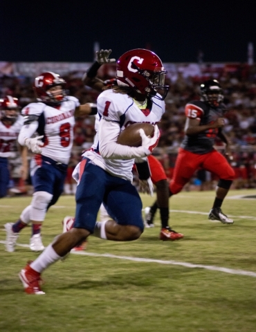 Coronado‘s DaQu‘an Davis (1) runs the ball upfield during their prep football ga ...