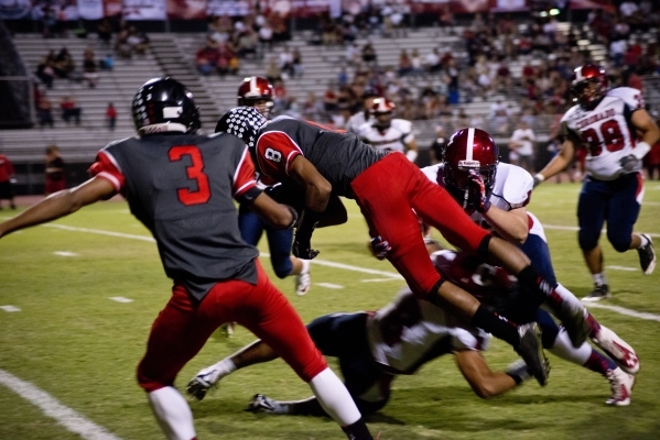 Las Vegas‘ Hanoi Rabago (8) dives for a touchdown during their prep football game at L ...