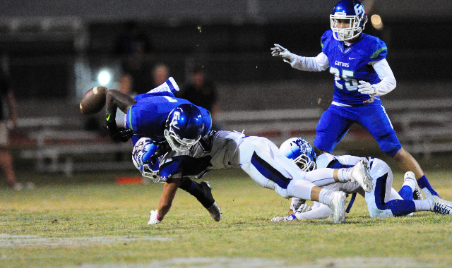 Basic Wolves safety Jake Waldron forces Green Valley Gators wide receiver Marquez Powell to ...