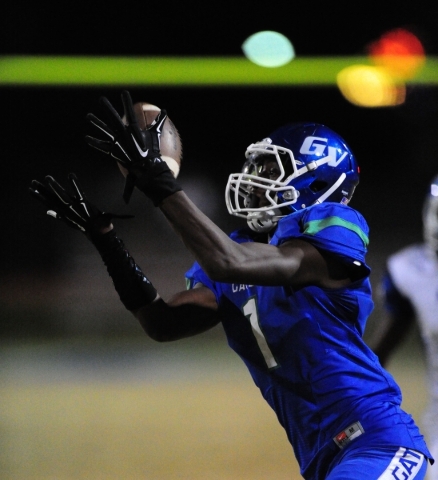 Basic Wolves quarterback Aeneas McAllister (11) scores a touchdown against Green Valley in t ...