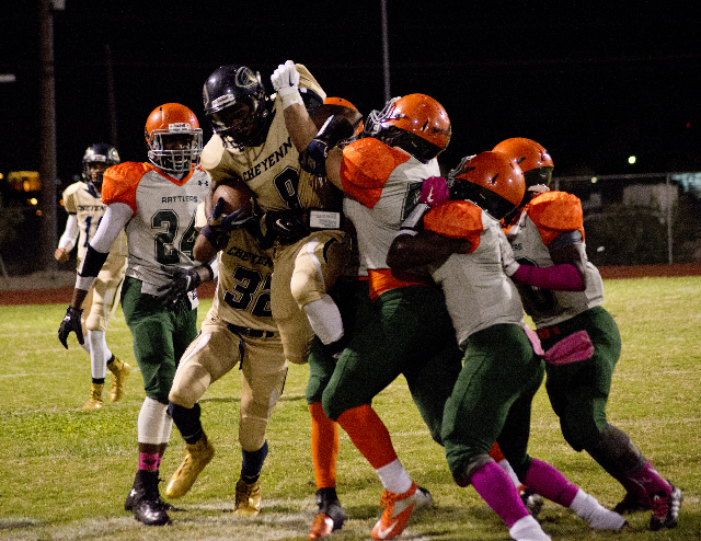 Cheyenne‘s Cameron Myles (8) is lifted out of bounds after a run during their prep foo ...