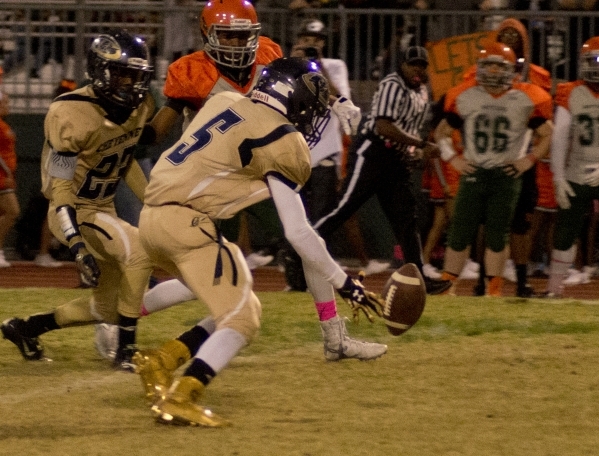 Cheyenne‘s Deriontae Green (5) fumbles the ball after he intercepted a pass during the ...