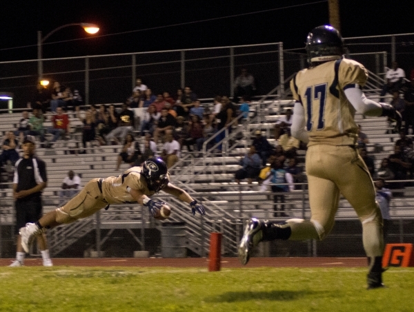 Mojave‘s Khalid Walker (7) runs the ball up field during their prep football game agai ...