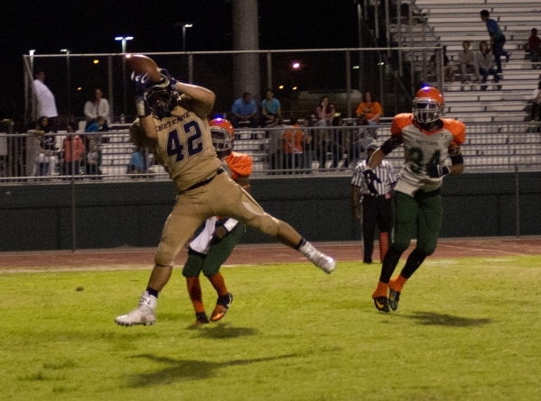 Cheyenne‘s George Carmona (42) jumps to retrieve a ball in the end zone during their p ...