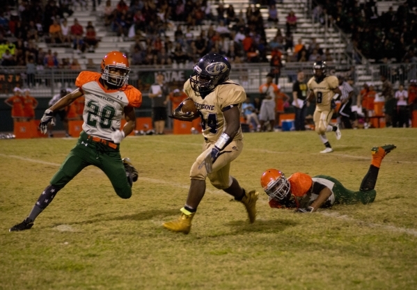 Cheyenne‘s David Walker (34) breaks tackles during a run downfield during their prep f ...