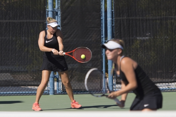 Chloe Henderson, left, and Sophie Henderson of Palo Verde High School play against Liberty H ...