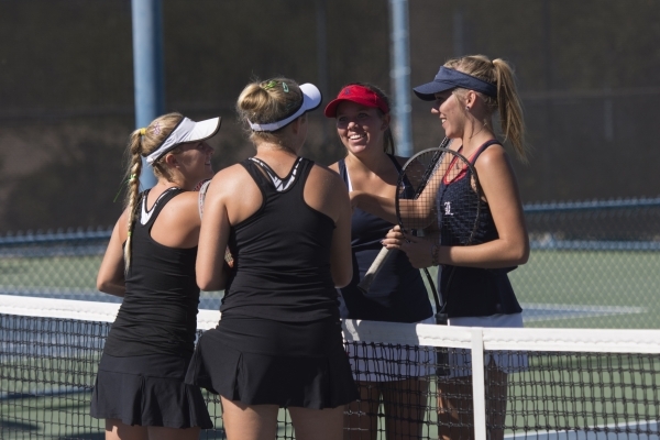 Sophie Henderson, from left, and Chloe Henderson of Palo Verde High School shake hands with ...