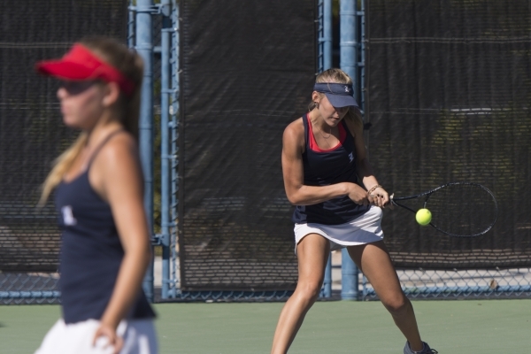 Parker Burk, right, and Payton Burk of Liberty High School play against Palo Verde High Scho ...