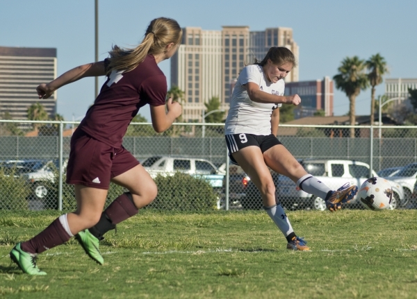 Clark High School‘s Darian Gambetta (9) kicks the ball in for a goal during their game ...