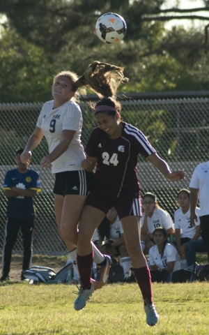 Clark High School‘s Darian Gambetta (9) and Pahrump Valley player Madeline Pereria (24 ...