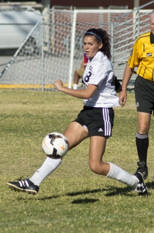 Clark High School‘s Ariana Reyes (18) kicks the ball in for a goal during their game a ...