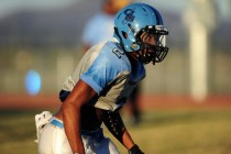 Canyon Springs running back Christian Minor lines up at the line of scrimmage during footbal ...