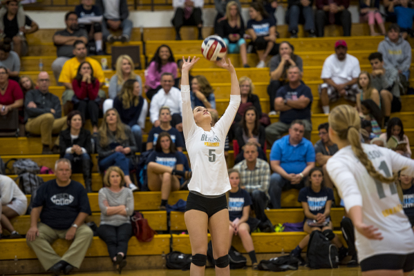 Hayley Huntsman of Bonanza puts the ball up into play during a volleyball match against Cent ...