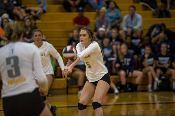 Hayley Huntsman of Bonanza puts the ball up into play during a volleyball match against Cent ...