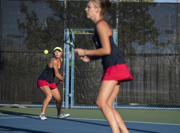 Twin sisters from left, Payton and Parker Burk from Liberty High School plays during their d ...