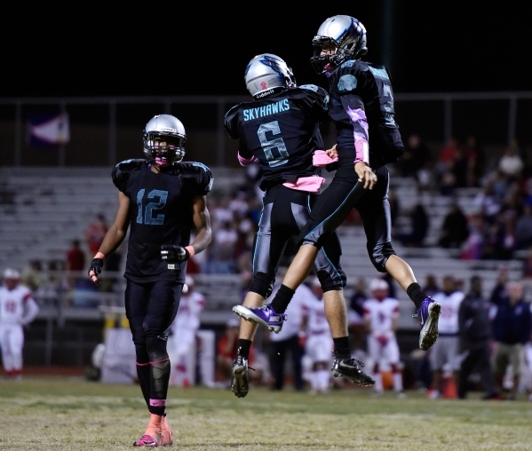 Silverado quarterback Christian Baltodano, right, celebrates his first half touchdown agains ...