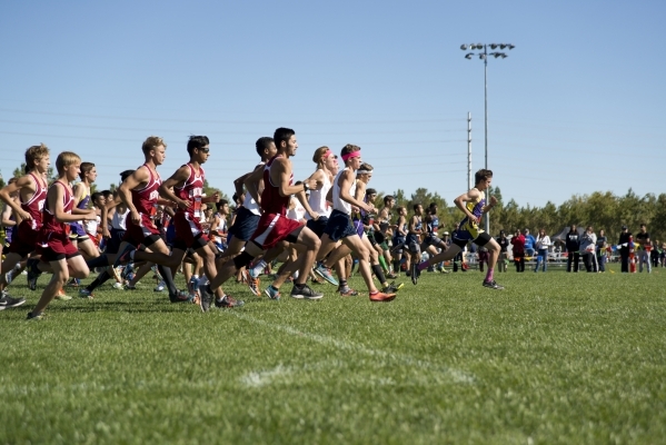 Runners begin the boys Division I Sunset cross country regional finals at Veterans Memorial ...