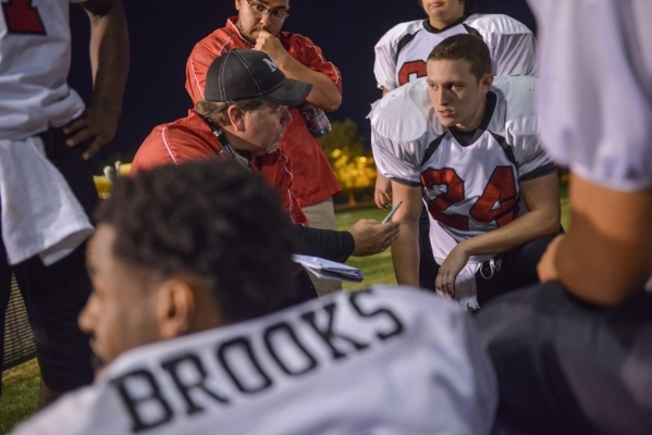 Mountain View Christian High School head football coach Ray LeBeouf draws up plays with play ...