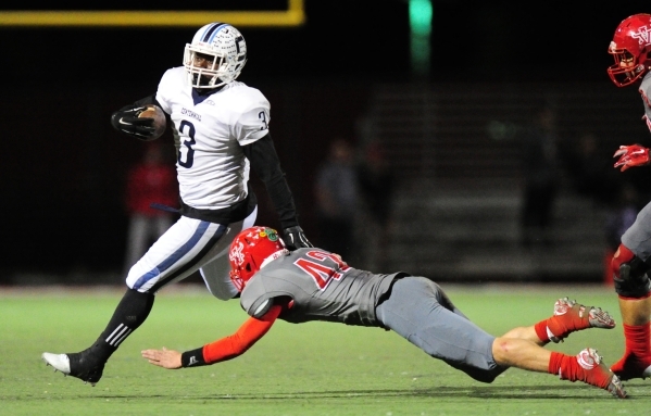 Centennial running back Rhamondre Stevenson slips past Arbor View linebacker Andrew Wagner w ...