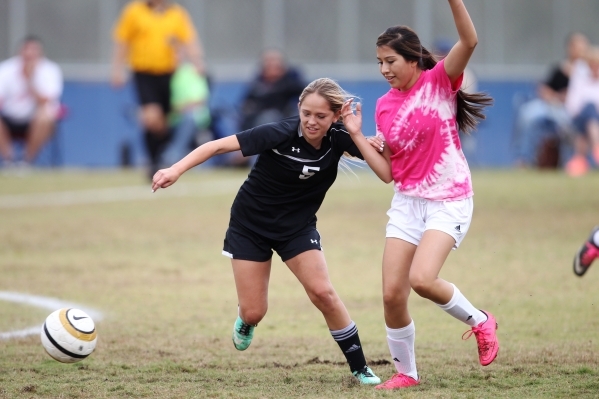 Palo Verde‘s Peyton Feller (5), left, fights for ball possession against Legacy in the ...