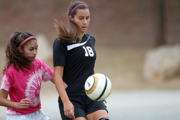 Palo Verde‘s Jadyn Nogues (18), right, fights for ball possession against Legacy in th ...