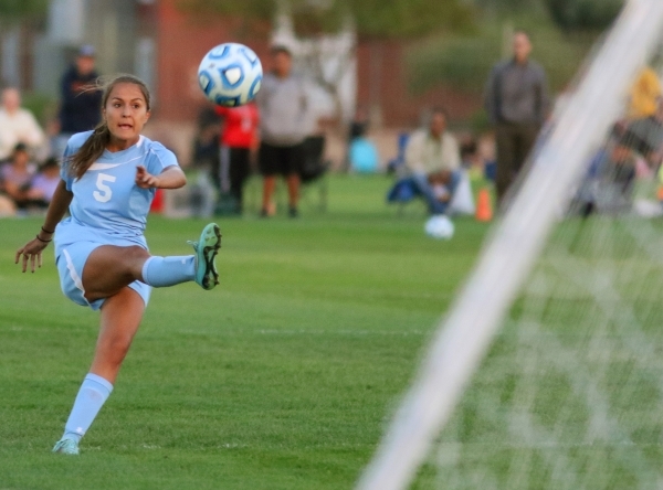 CentennialÃ­s Cameron Sickels kicks the ball during a Division I Sunset Region girls socce ...