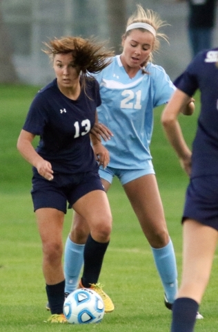 Shadow RidgeÃ­s Taylore Simmons, front, has possession of the ball and is guarded by Cente ...