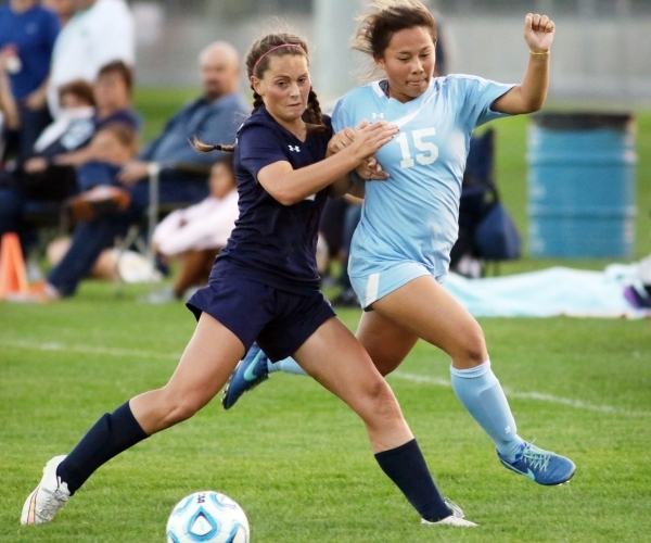 Shadow RidgeÃ­s Cheyenne Banks, left, and CentennialÃ­s Victoria Cera get tangled when g ...