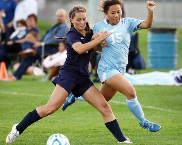 Shadow RidgeÃ­s Cheyenne Banks, left, and CentennialÃ­s Victoria Cera get tangled when g ...