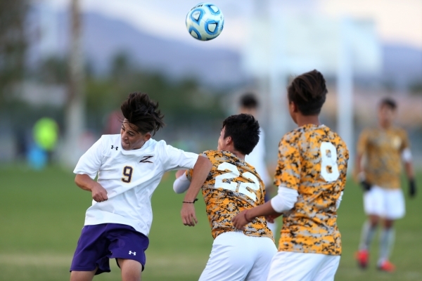 Durango‘s Jaime Munguia (9) fights for ball possession against Bonanza‘s Taichi ...